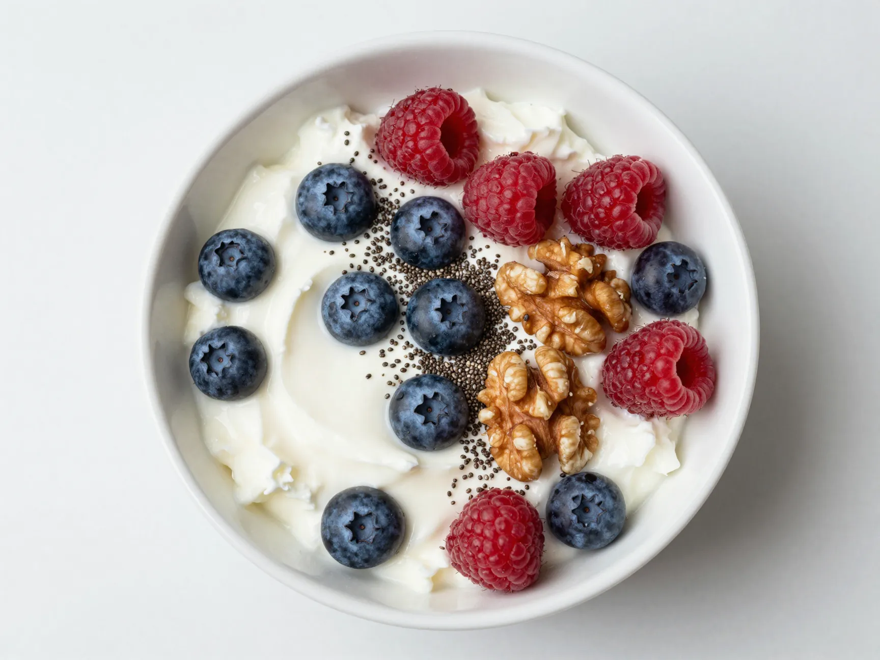 Bowl of cottage cheese with berries and seeds
